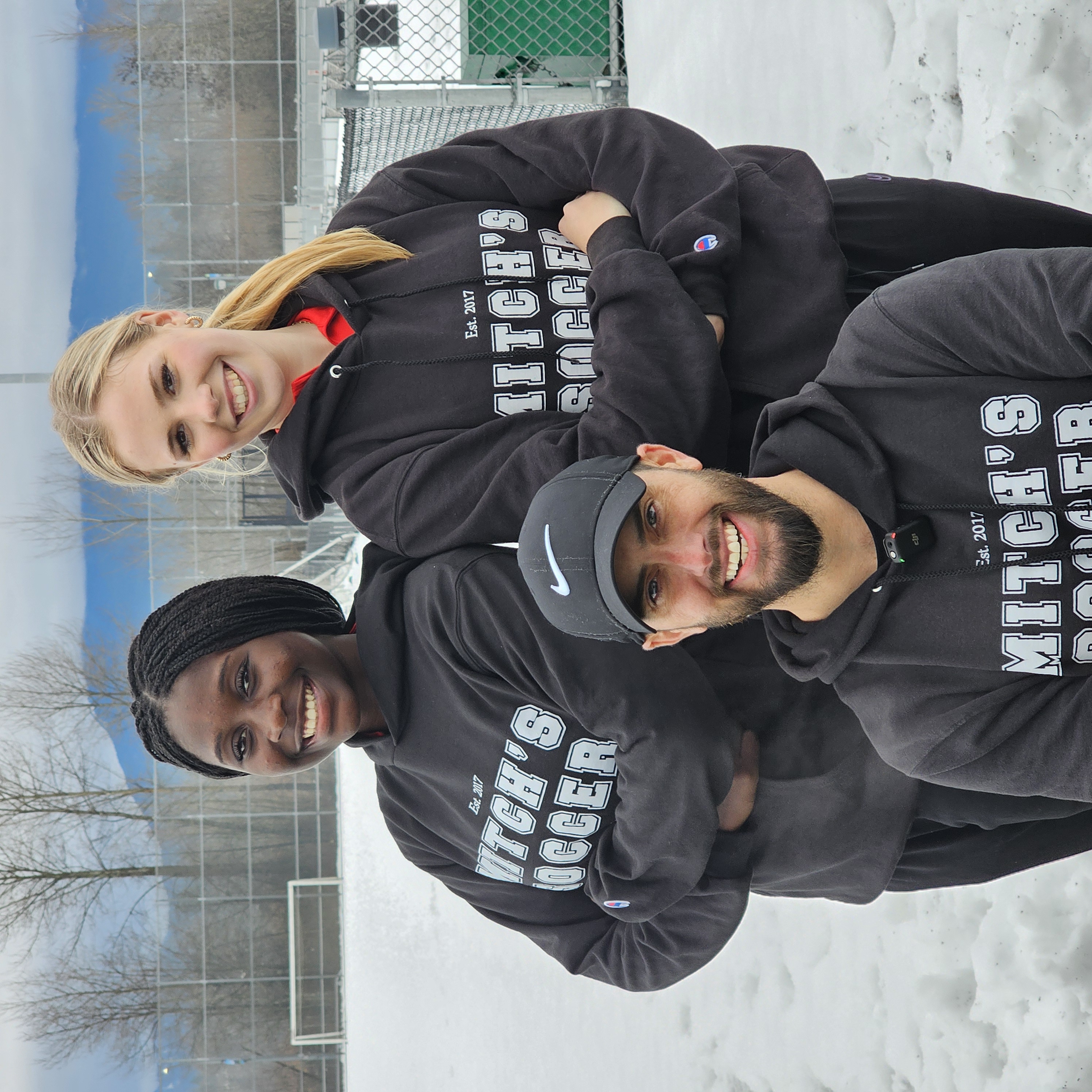 Bridget with coach and teammate in Mitch's Soccer hoodies