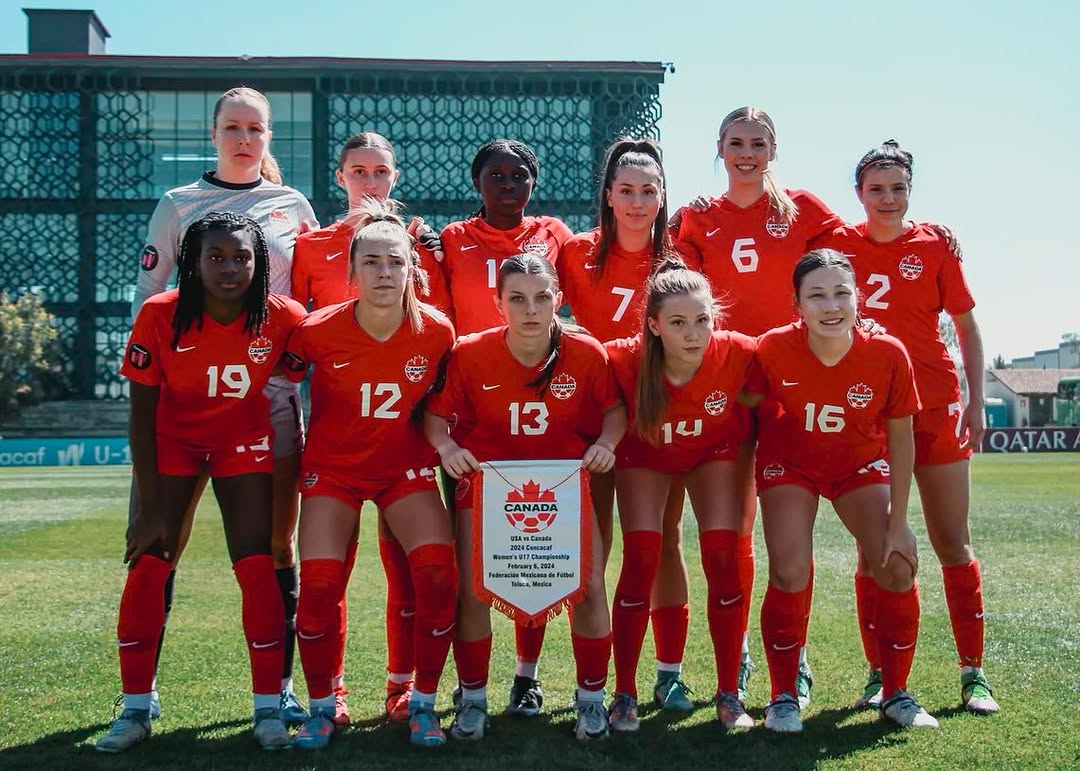 Team Canada formal photo with pennant