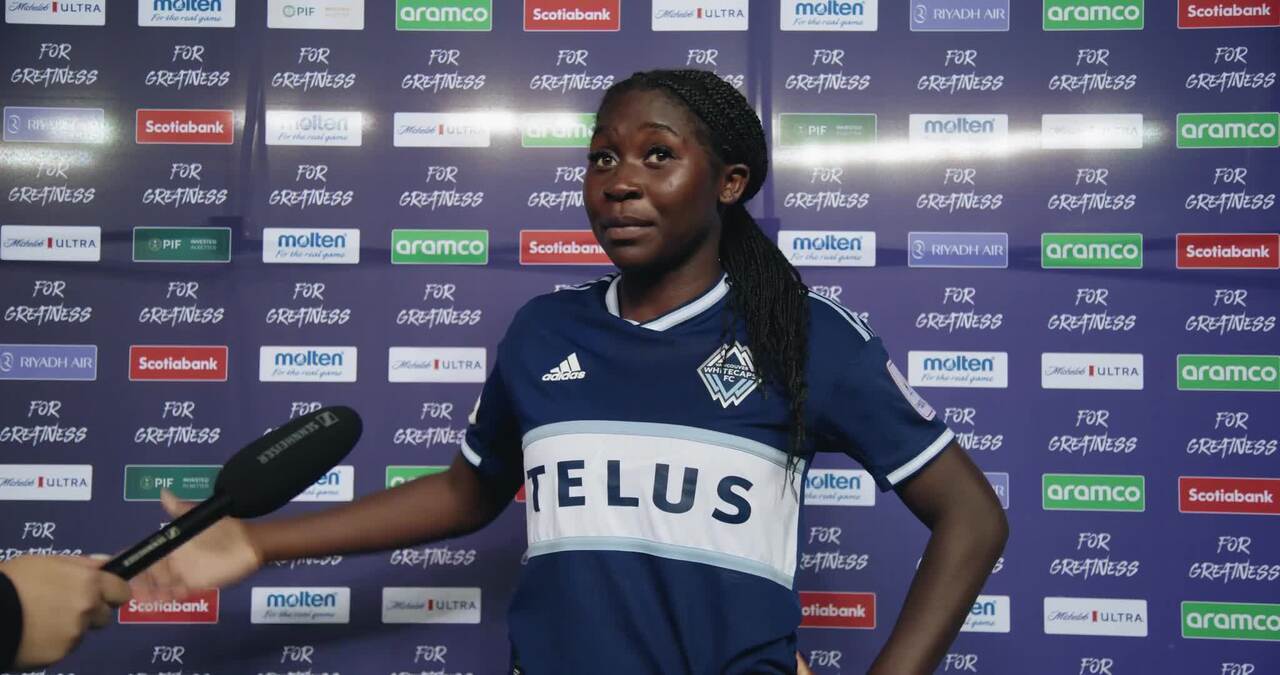 Bridget in Whitecaps jersey with TELUS sponsor